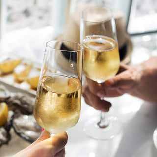 Bottle of OSAN Bulles TM Marigold Mirabelle, an alcohol-free sparkling beverage with golden hues, 750ml bottle