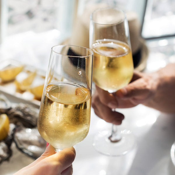 Bottle of OSAN Bulles TM Marigold Mirabelle, an alcohol-free sparkling beverage with golden hues, 750ml bottle