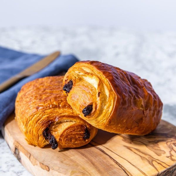 Pre-baked pain au chocolat in a 260-piece package showing multiple chocolate-filled pastries ready to bake