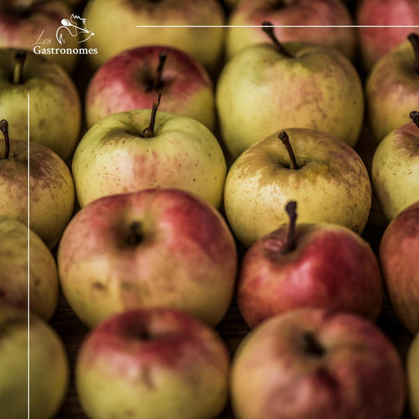 Fresh juicy Reinette apple with green-yellow skin and russet patches, ready for eating or cooking, per piece