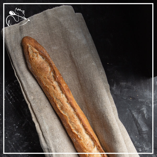 Fresh artisan French baguette tradition with crispy golden crust, handcrafted by bakers using traditional methods