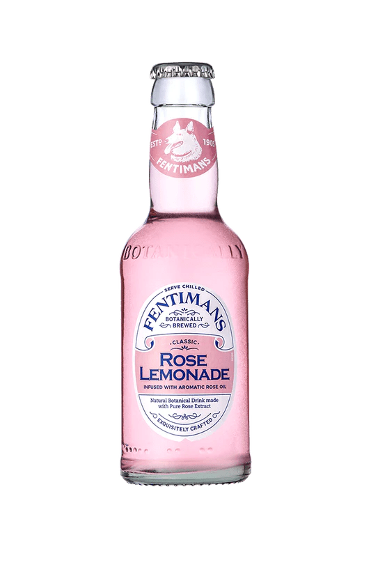 Bottle of Fentimans Rose Lemonade 275ml with pink refreshing beverage, premium botanical soft drink in glass bottle