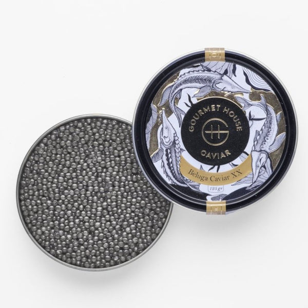Fresh Iranian Royal Beluga caviar served in a crystal bowl, showcasing its premium black pearls and luxurious texture