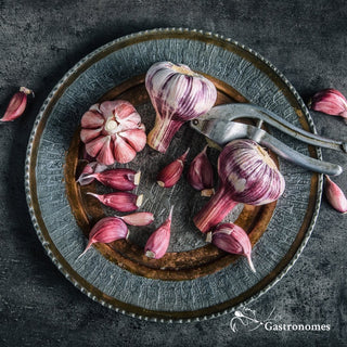 Purple Cadours garlic with distinctive purple-striped skin, a premium AOP certified variety from France, sold as single piece