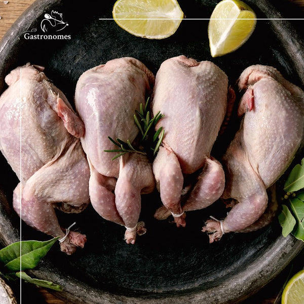 Whole quail from France, unplucked and ready for cooking, a high-quality game bird for gourmet dishes.