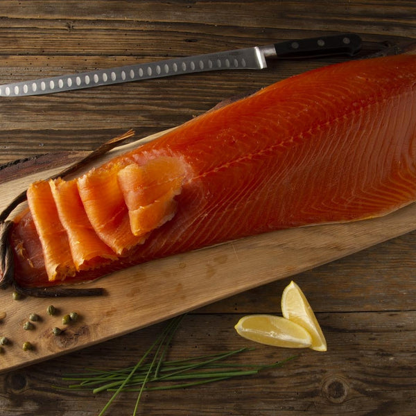 Scottish smoked salmon whole fillet d-cut showing premium quality texture and vibrant color on wooden board
