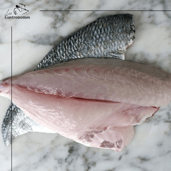 Fresh wild sea bream fillets on ice, ready to cook, with tender pinkish flesh and skin-on preparation, 600-800g package