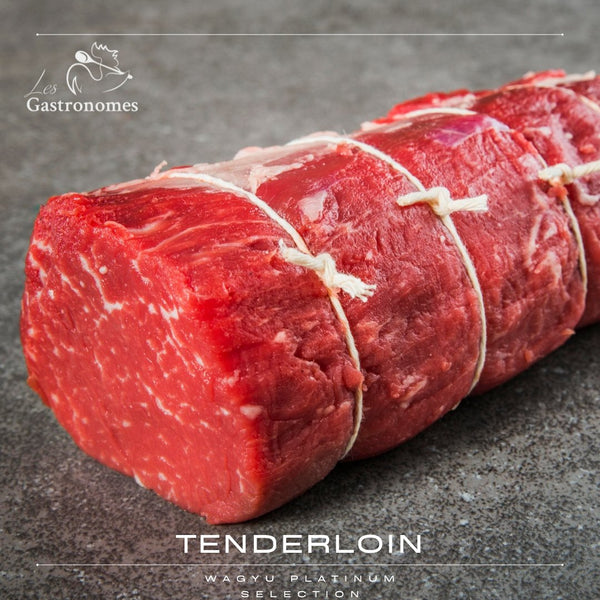 Tenderloin roast of premium Wagyu 5+ platinum selection, 1kg cut of marbled beef ready for cooking, displayed on dark surface