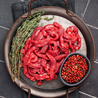 Wagyu beef strips with marbled texture, high-quality grade 4+ premium meat, raw frozen, ready for cooking gourmet meals