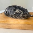 Artisan bread with activated charcoal offering health benefits and unique black color for gourmet food enthusiasts