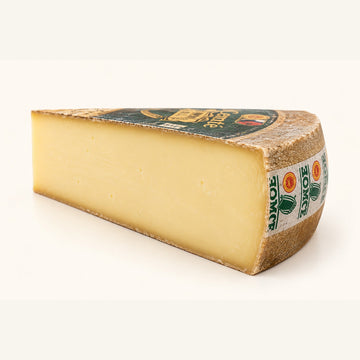 Comté 6 Months 200g wedge, warm ivory studio representation