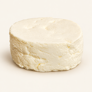 Brillat-Savarin Frais fresh cheese wheel, illustrative studio image