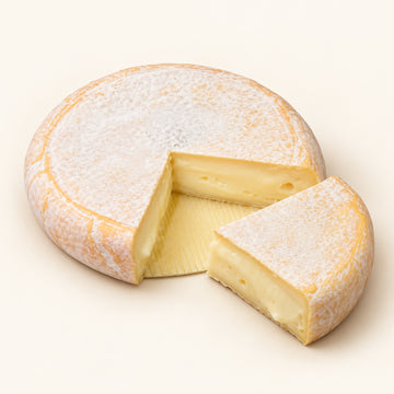 Reblochon de Savoie Fermier AOP whole wheel with cut wedge