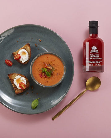 A bottle of red bell pepper and espelette pepper vinegar from A L'Olivier, perfect for adding zesty flavor to dishes.