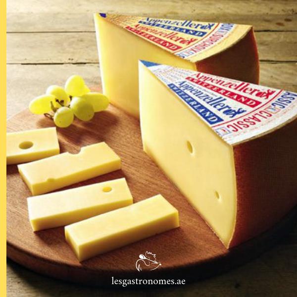 Appenzeller black label cheese wheel with a smooth, orange-brown rind and firm texture, produced in Switzerland.