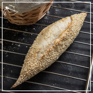 Handcrafted mini French baguettes with golden sesame topping, freshly baked artisanal bread in a pack of five