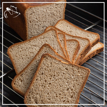 Freshly baked artisan rye toast bread loaf with crispy golden crust, ideal for sandwiches and breakfast