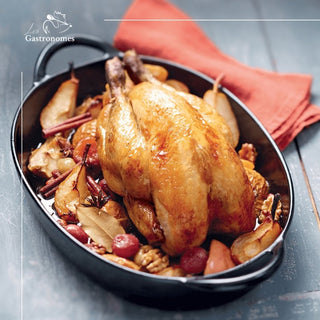 Christmas guinea fowl stuffed with festive sides, oven-ready for holiday dinner, served in baking tray