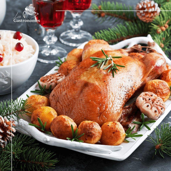 Christmas turkey with sides ready to bake, uncooked stuffed festive bird with vegetables for holiday dinner