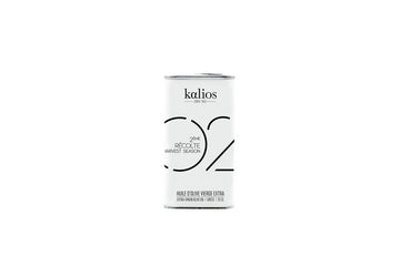Extra virgin olive oil in a 250ml dark glass bottle with minimalist label, traditional cold-pressed quality