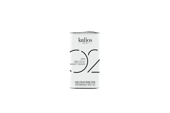 Extra virgin olive oil in a 250ml dark glass bottle with minimalist label, traditional cold-pressed quality