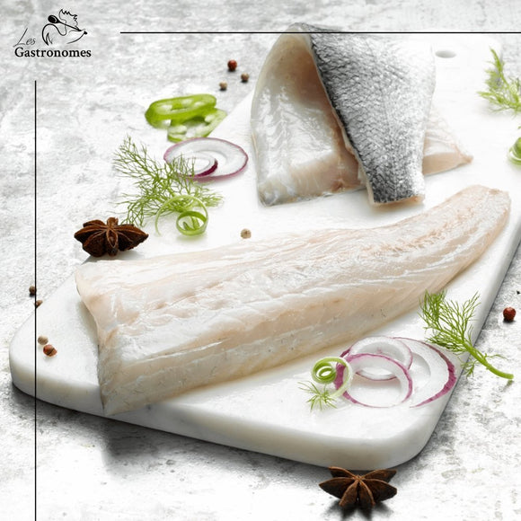 Frozen wild sea bass fillets packaged in eco-friendly wrapping, ready for cooking, sustainably sourced, 600-800g weight