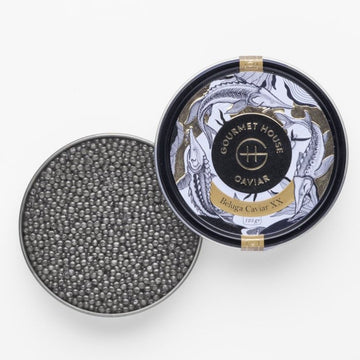 Fresh Iranian Royal Beluga caviar served in a crystal bowl, showcasing its premium black pearls and luxurious texture