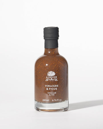 Delicious fig-infused vinegar bottle from L'Olivier, perfect for enhancing salads and gourmet dishes with its sweet flavor