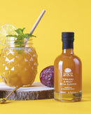 Passion fruit infused vinegar from L'Olivier in an elegant glass bottle, perfect for gourmet salad dressings