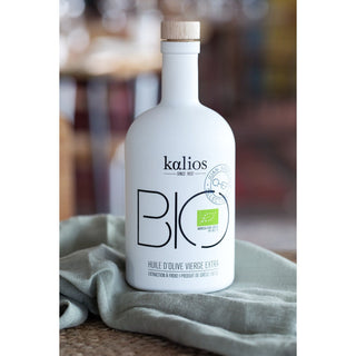 Organic extra virgin olive oil in a glass bottle with rich golden color for healthy Mediterranean cooking