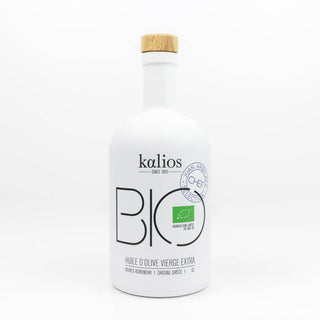 Organic extra virgin olive oil in a dark glass bottle with premium quality label, cold-pressed artisanal product