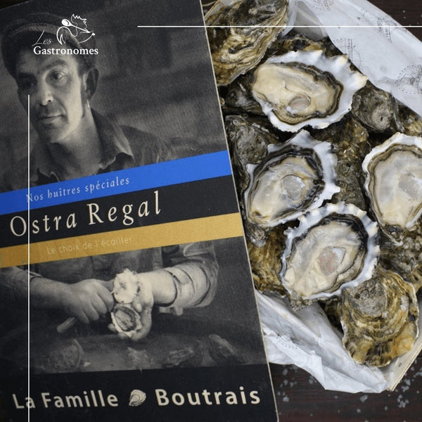 Fresh Ostra Regal No.2 oysters arranged neatly in a shell tray, premium seafood delicacy with 12 pieces ready to serve