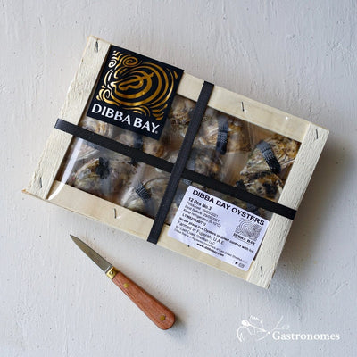 Fresh Dibba Bay oysters, no4 size, arranged in a clean wooden box with 16 premium pieces ready for seafood dining