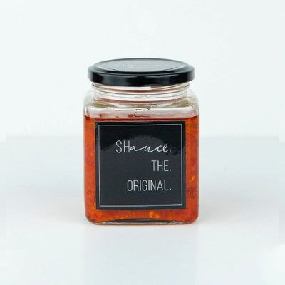 The original SHauce hot sauce 200g bottle with orange cap and spicy chili pepper flavored condiment for meals