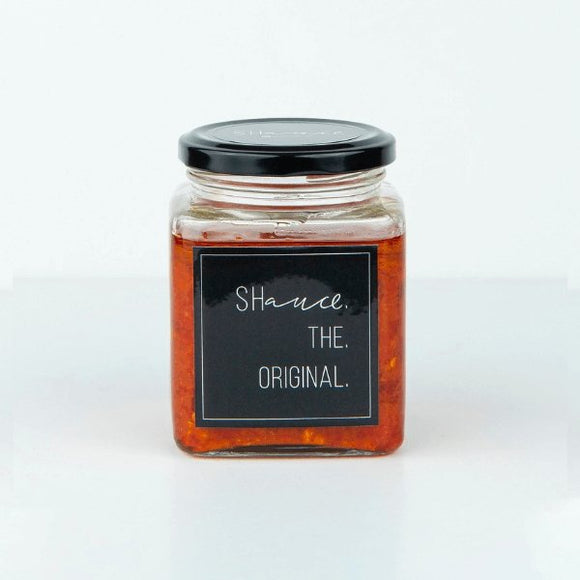 The original SHauce hot sauce 200g bottle with orange cap and spicy chili pepper flavored condiment for meals