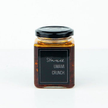 The umami shauce in a 200g jar with a sleek black label, perfect for adding savory flavor to your dishes