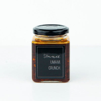 The umami shauce in a 200g jar with a sleek black label, perfect for adding savory flavor to your dishes