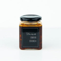 The umami shauce in a 200g jar with a sleek black label, perfect for adding savory flavor to your dishes