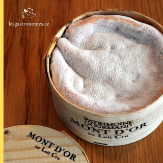 Vacherin mont d'or aop, a creamy soft french cheese with distinctive wooden box packaging, traditional specialty