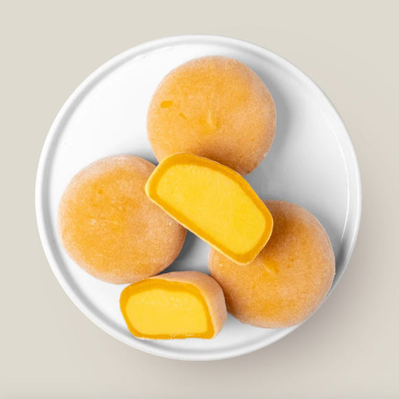 Creamy vegan mango mochi ice cream set with 8 pieces, perfectly round treats with delicate exterior and sweet filling