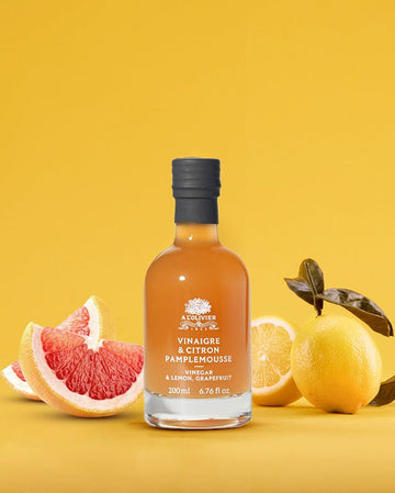 Citrus-infused vinegar with fresh lemon and grapefruit for homemade cleaning and cooking solutions