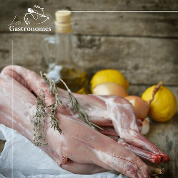 Whole frozen rabbit meat prepared for cooking, displayed on white background, perfect for pet food or recipes