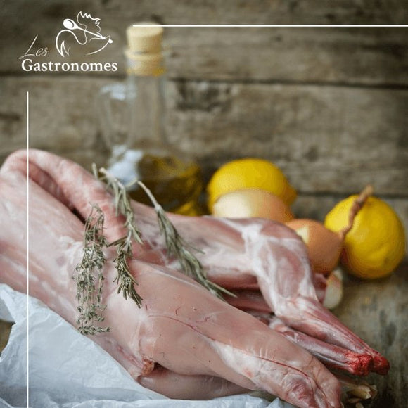 Whole frozen rabbit meat prepared for cooking, displayed on white background, perfect for pet food or recipes